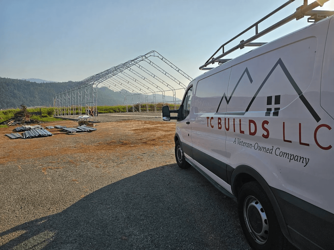 TC BUILDS van in front of a building under construction