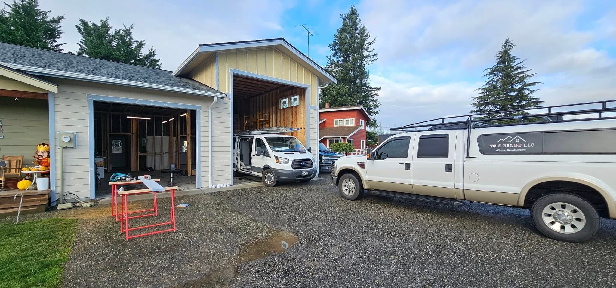 TC BUILDS truck in front of a residential remodeling project in progress