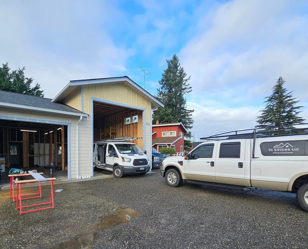 TC BUILDS truck in front of a residential remodeling project in progress